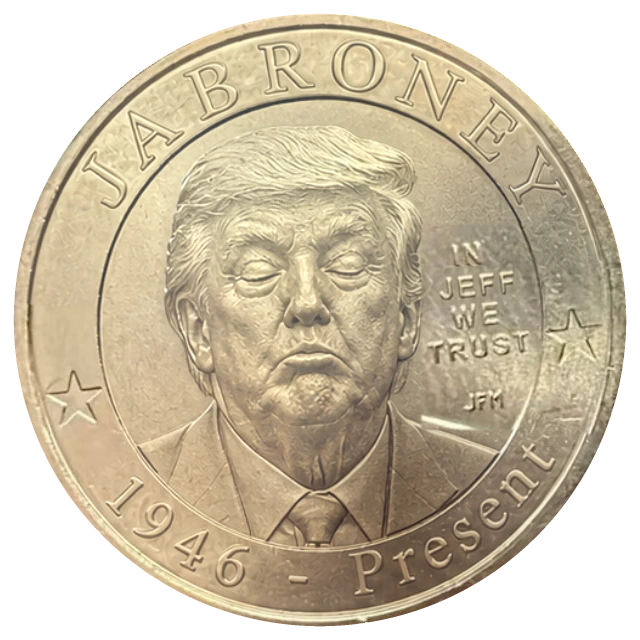 Le Jabroney : une pièce d’un dollar en or portant l’inscription JABRONEY et le portrait d’un homme aux yeux fermés et aux lèvres pincées.